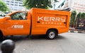 Kerry express orange pick up truck collecting parcel and express mail services.